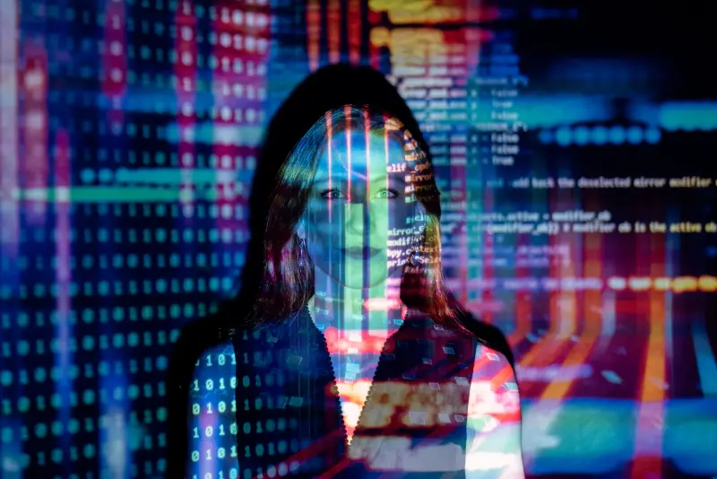 Close-up of laptop screen showing software development environment with code