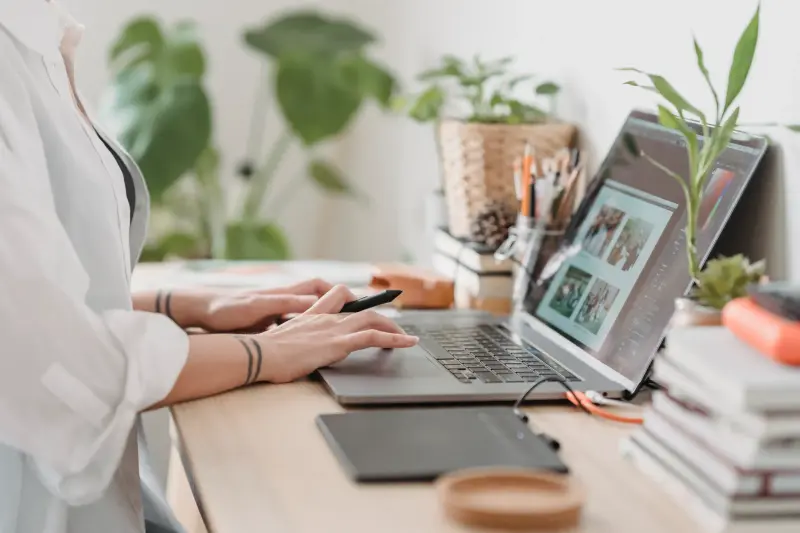 Minimalist workspace with laptop showing document editing interface