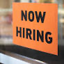 Now hiring sign representing the US August employment report